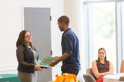 student getting a certificate